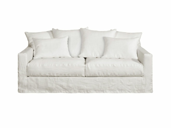 Canapé blanc Homesprit Biscarrosse avec quatre grands coussins de dossier et deux petits coussins latéraux, déhoussables pour faciliter le nettoyage, photographié sur un fond blanc. Canape Paris by Atelier Bis