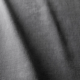 Gros plan sur un tissu gris dont la texture est visible et qui présente des plis verticaux souples. Canape Paris by Atelier Bis