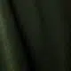 Gros plan sur un tissu vert foncé dont la texture et les plis sont visibles. Canape Paris by Atelier Bis