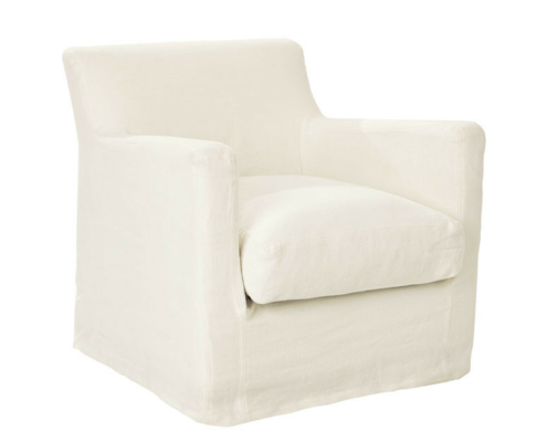 Fauteuil blanc rembourré, de forme carrée, avec une base à jupe, vu de biais. Canape Paris by Atelier Bis