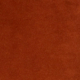 Surface texturée solide de couleur brun-rouge, peut-être du daim ou un matériau similaire, montrée en gros plan. Canape Paris by Atelier Bis