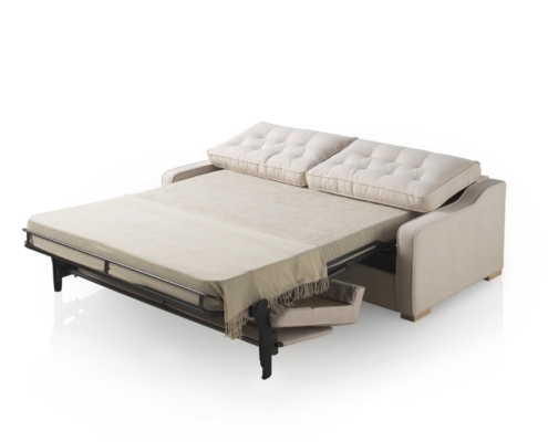Canapé beige convertible PAMPELUNE déplié avec des coussins et une couverture légère, isolé sur fond blanc. Canape Paris by Atelier Bis