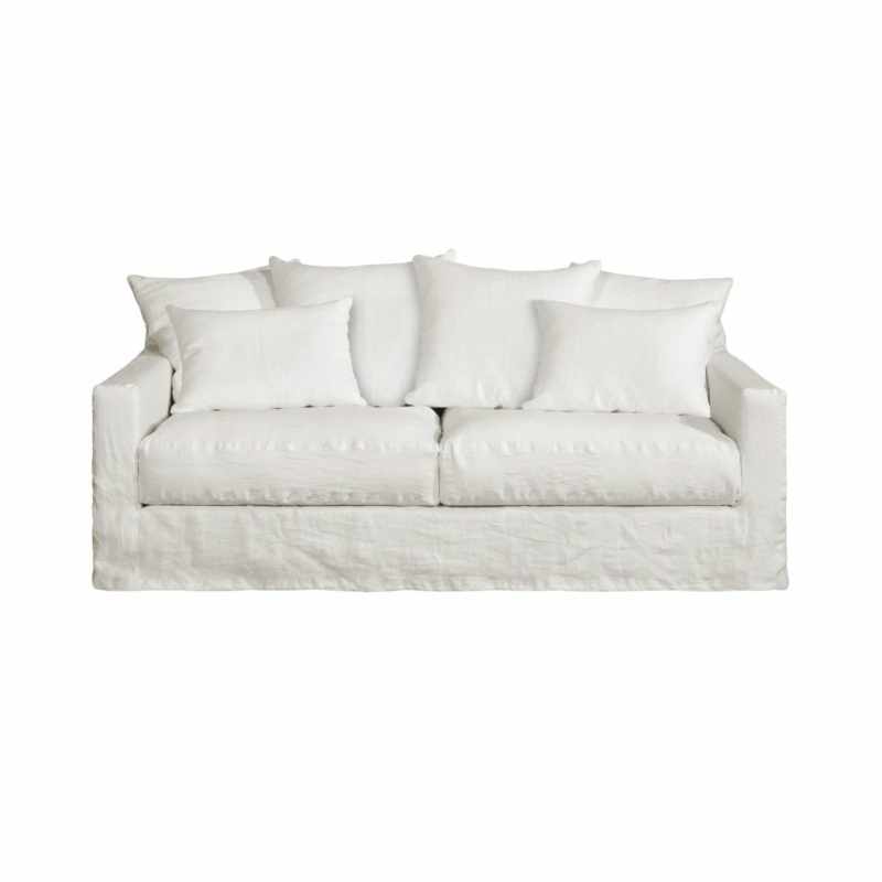 Canapé blanc Homesprit Biscarrosse avec quatre grands coussins de dossier et deux petits coussins latéraux, déhoussables pour faciliter le nettoyage, photographié sur un fond blanc. Canape Paris by Atelier Bis